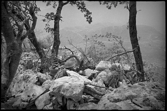 New Zealand Bren gunner C A Coleman provides covering fire in forward areas of 8th Army Front, Italy World War II - Photograph taken by George Kaye