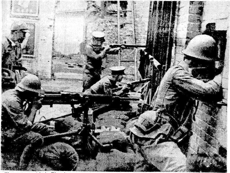 The present crisis in Tientsin serves as a reminder that two years ago there ivas vicious street fighting in the Chinese city, when the Japanese forces first took possessioii. In the above picture Chinese soldiers are seen defending part of the city in 1937. (Evening Post, 15 June 1939)