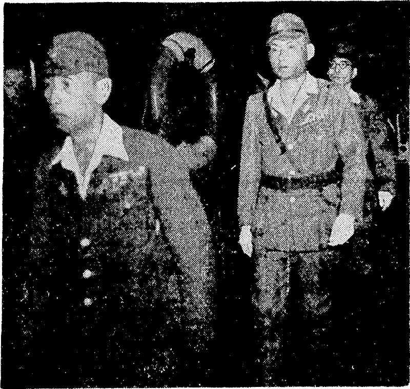 Lieut.-General Ranch, followed by V'ice-Admiral Samejima, being conveyed aboard H.M.A.S. Diamantina to the headquarters of Lieut.-General Savige for the ceremony of formal surrender of the Japanese forces on Bougainville Island. (Evening Post, 19 September 1945)