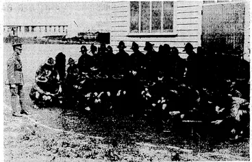 Image: Evening Post" Photo. COLLEGE BARRACKS AT RONGOTAI. Â— N.C.O.s of Rongoidi College Cadets undergoing instruction Hn- the handling of' Lewisguns at the annual barracks-now Being held in the'grounds-bf'the' ' Â– ' college. . . ' ■ Â– , (Evening Post, 04 March 1936)