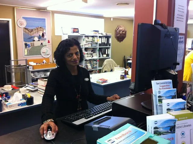 Librarian uses the new GO-GO terminal, Thames Library.photo-1