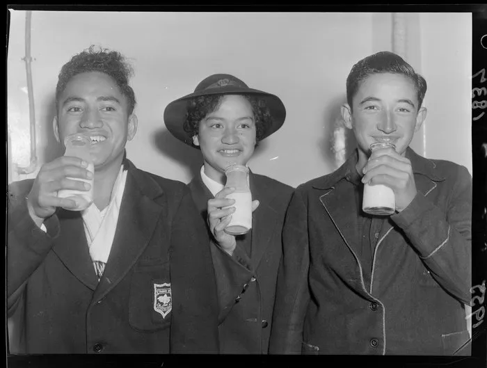 Maori children from Tokomaru Bay District High School sample milk from bottles at the Wellington Municipal Milk Department