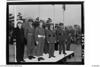 British Commonwealth Occupation Force (BCOF) Commander in Chief Lieutenant General H C H Robertson (front row,centre), stands on the dais watching his farewell parade at Anzac Park, Kure, Japan.   ..