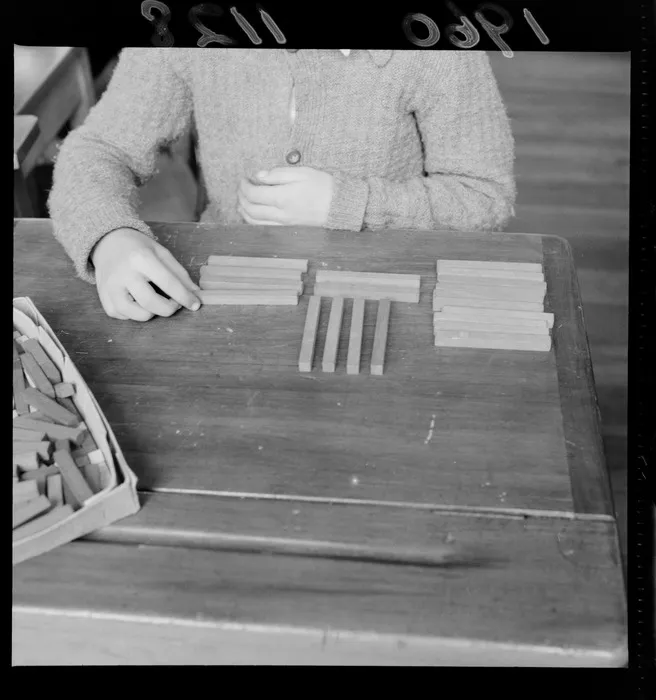 Cuisenaire rods laid on a desk demonstrating the 'strip' method of learning arithmetic, probably Wellington region