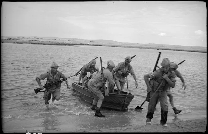 Assault party lands its folding assault boat, Egypt
