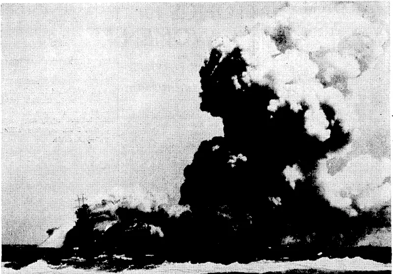 Turned into a blazing inferno by three torpedoes from a Japanese submarine, the 14,700-ton United States aircraft-carrier Wasp lists to starboard. The Wasp, which was the neivest carrier in the United States Navy, was attacked while escorting ships with supplies for Guadalcanal. The white streak in the foreground is the wake of the ship from which this picture was taken. (Evening Post, 12 January 1943)