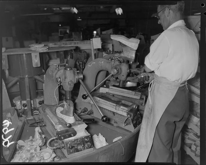 Man operating machine at Buchanan and Edwards shoe factory