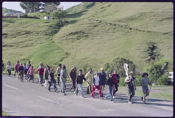 Marchers walking on a road
