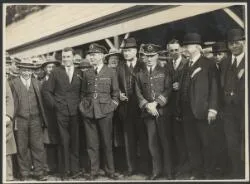T.H. McWilliam, Charles Ulm, Charles Kingsford Smith and H.A. Litchfield, with unidentified men at Wellington Trotting Club, Trentham Racecourse, Wellington, New Zealand, September 1928 / W. Hall Raine
