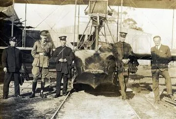Japanese visitors in front of a seaplane : Photograph