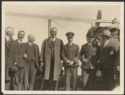 Mayor of Auckland, George Baildon, and four other men farewelling Charles Kingsford Smith and Charles Ulm on their departure from Auckland, New Zealand, September 1928