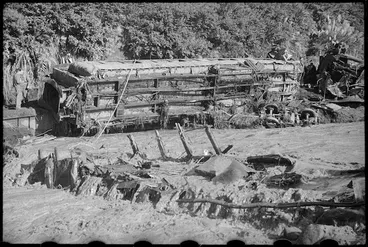 Image: Wrecked railway carriages on the banks of the Whangaehu Stream at the scene of the railway disaster at Tangiwai