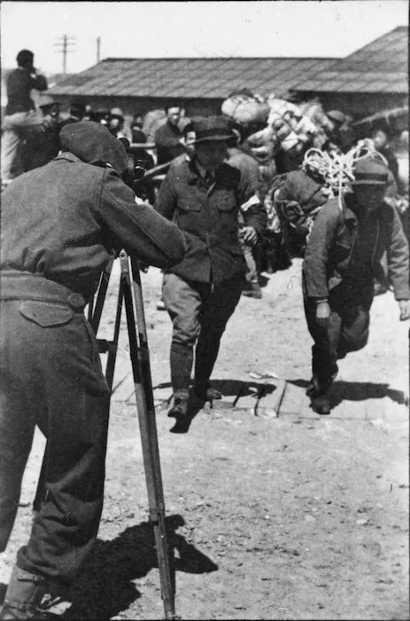 Army photographer photographing Korean repatriates