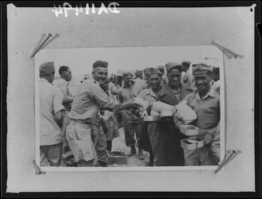 Image: Members of 28 (Maori) Battalion in line for patriotic parcels, near Tripoli - Photograph taken by Dr C N D'Arcy