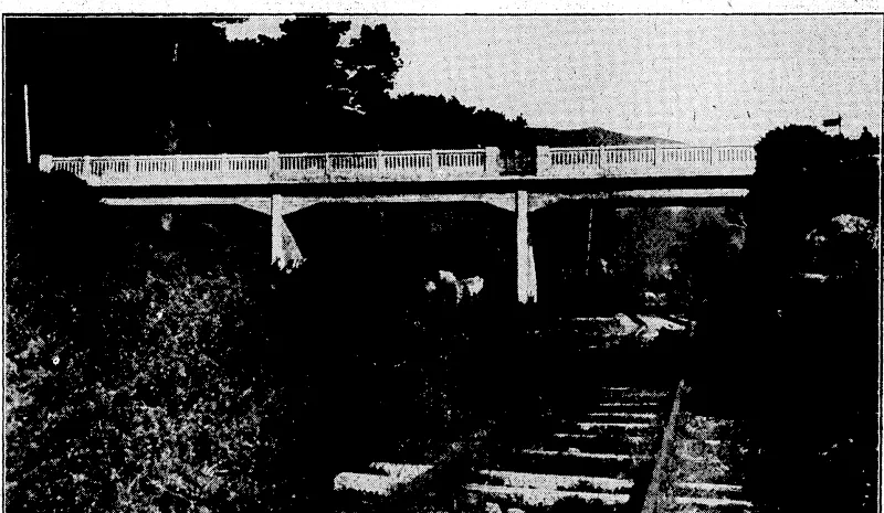 PAGODA' OVERTURNED.—This fine pagoda, which stands m the grounds o/ the famous Buddhist Temple of Tennoji, at-Osdka, was overturned by the fierce typhoon reported to be raging in Japan, after having withstood the storms of centuries. It is said to .contain the first Buddhist image taken to Japan.' ' ■ i ) ■ ' ' , "Evening Post"; Photon ON'THE-GREAT NORTH ROAD.—A view of*,the>concrete bridge which has been erected across the Tawa Flat railway deviation • between'Glenside and Tawa Flat. It is at'the start of the road to Takapu where it leaves the main North Road. (Evening Post, 22 September 1934)