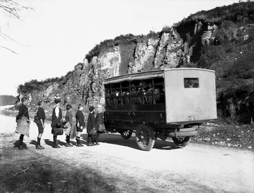Image: Children boarding a Department of Education school bus