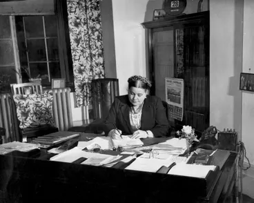 Image: Mabel Howard writing at her desk