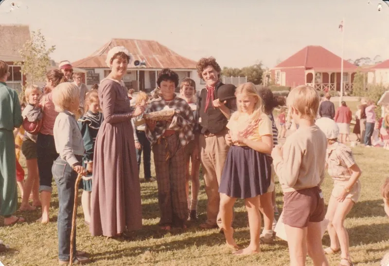 Marin Burgess and Jeff Milne, in costume ,with the winner of the Colonial Boy Competition, Christian Yates at Howick Historical Village during the 1080 Gala in October 1983.