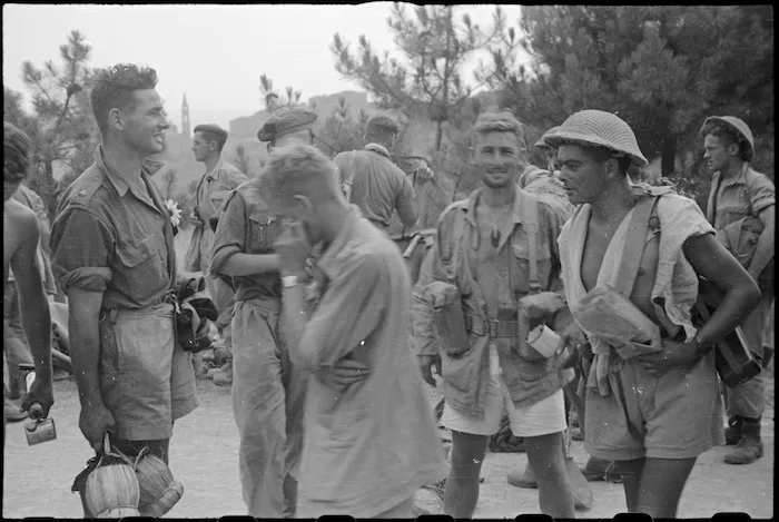 Members of 26 New Zealand Battalion who took part in attack on Lignano, Italy, awaiting transport to rear - Photograph taken by George Kaye