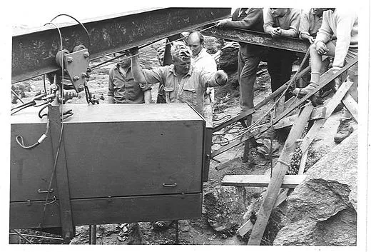 Graeme Hastie directing operations while installing clock mechanism