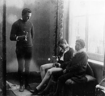 Image: A man and two boys in costume : photograph