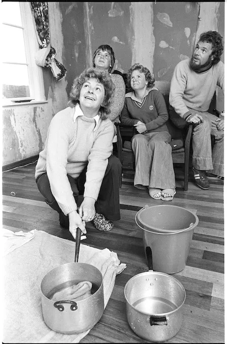 Smith family inside their leaking house in Wainuiomata, Lower Hutt, after a portion of the roof blew off in high winds