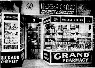 Image: A MODERN PHARMACY. *ln character ... in manner ... in style ... in all things. This describes the newly-designed pharmacy just installed by MR. H. J. S. RICKARD, CHEMIST, of 3 WILLIS STREET, WELLINGTON. It features a new lighting system and the opening up of the window in such a manner as to give a clear view of the whole pharmacy. Internally, the pharmacy carries an atmosphere of dignity; yet on modern lines, adopting the open Dispensary, where patrons may witness the compounding of their • own prescriptions by qualified chemists only. A most complete stock of Drugs and Toilet Requisites is carried, besides Trusses and Belts of all kinds. Mr. Rickard extends an invitation to inspect this up-to-the-minute Pharmacy.—P.B.A. ' : : (Evening Post, 31 August 1940)