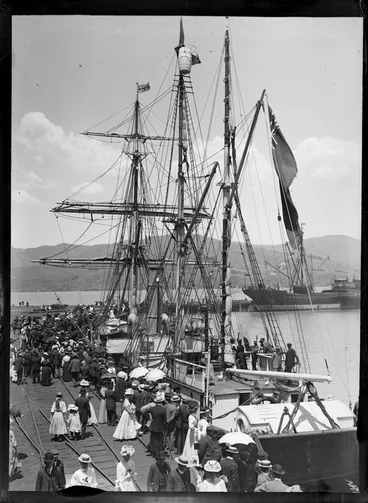 Image: Crowd at Lyttelton Wharf, Christchurch, to witness the departure of ship 'Nimrod' for Antarctica, on British Antarctic Expedition, showing men, women, and children on ship and on wharf alongside