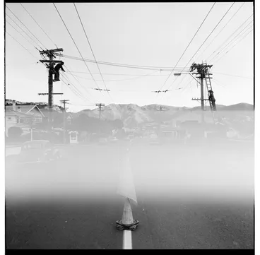 Image: Linesmen up ladders, possibly in Karori looking up towards Wrights Hill
