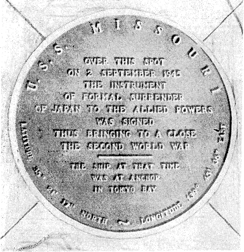 The bronze plaque which marks the deck area of U.S.S. Missouri where the, Japanese surrender terms ivere signed while the battleship lay at anchor in Tokio Bay. (Evening Post, 17 November 1945)