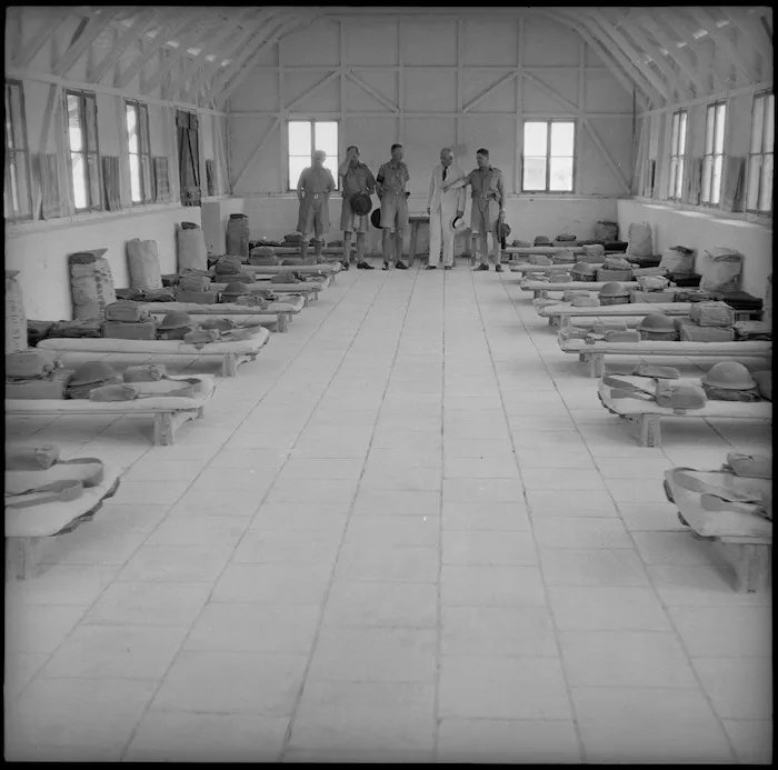 Prime Minister Peter Fraser inspecting the interior of a military hut, Egypt