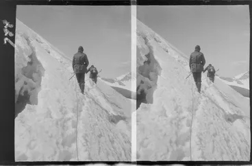 Image: Edgar Williams' Mount Aspiring trip, view of two mountaineers with ropes and ice axes traversing a snow slope on Mount Aspiring, Central Otago Region