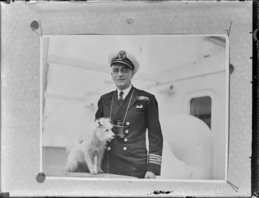 Image: Captain Enright in uniform, Port Phillip, with a small dog
