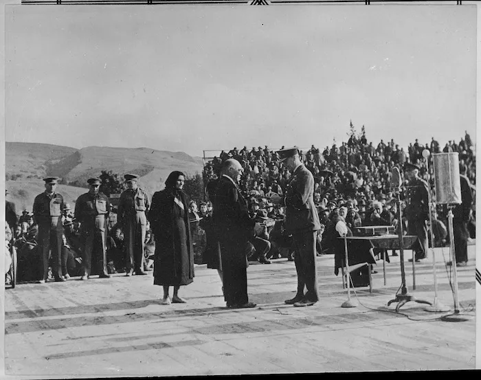 Sir Cyril Newall presents to Mr Hamuera Ngarimu the VC awarded to 2 Lt Te Moananui-a-kiwa Ngarimu - Photograph taken by J D Pascoe