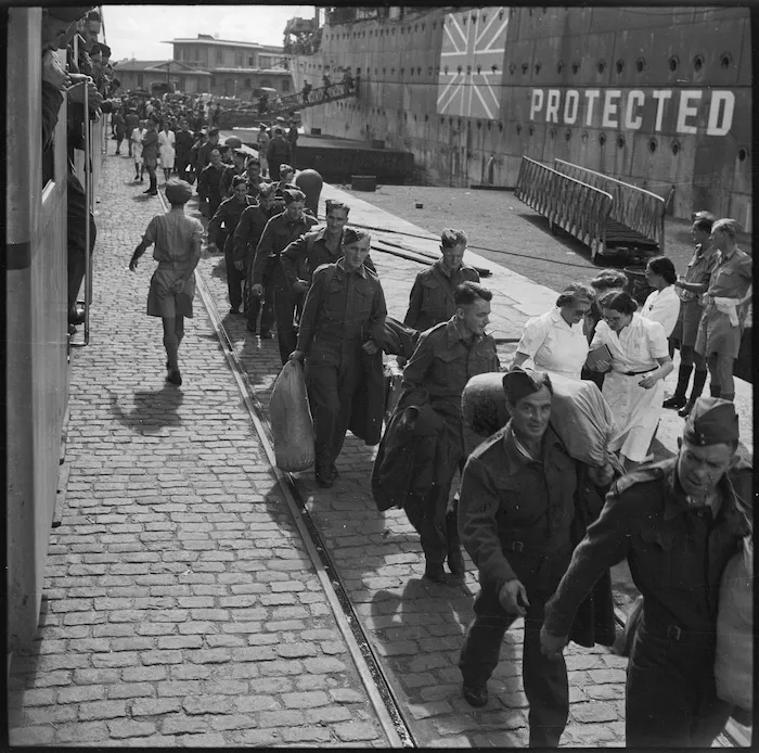 New Zealand protected military personnel repatriated from Germany move along the quay at Alexandria - Photograph taken by George Robert Bull