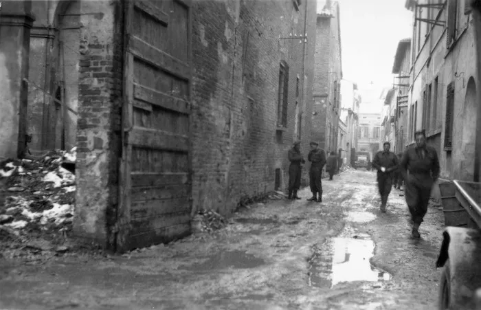 A M Miller (Photographer) : Street in Faenza, Italy, with members of the 26th Battalion
