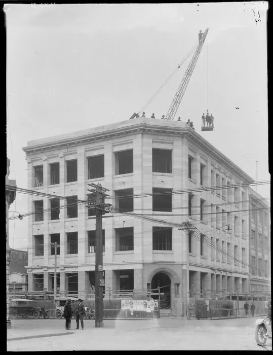 Pyne Gould Guinness building under construction, with crane on roof, Christchurch