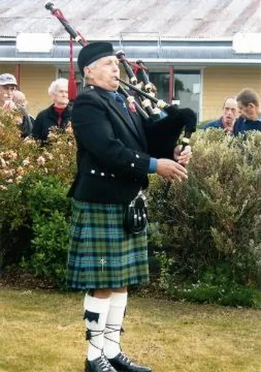 Image: Malcolm Sutherland playing the bagpipes at Featherston on ANZAC Day