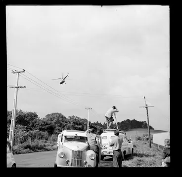 Image: A helicopter being filmed by a TV News crew