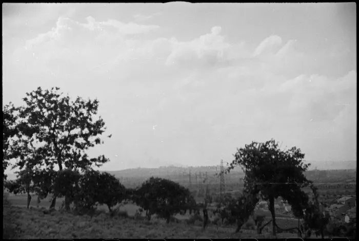 Smoke rising from Rimini, Italy, as it receives heavy bombardment in World War II - Photograph taken by George Kaye