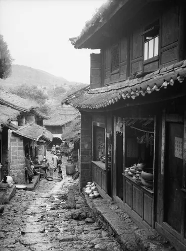Image: Yunnan, China. Lijiang; street with copper shops, September 1938.
