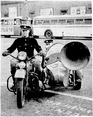 Image: The police at Durban, South Africa, are experimenting ivith a motor-, cycle and side-car loud-speaker outfit for directing traffic. Its main advantage is that it can be parked in a smaller area 4han a car. (Evening Post, 05 August 1939)