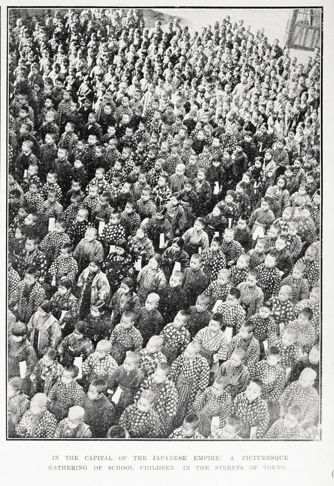 In the capital of the Japanese Empire: a picturesque gathering of school children in the streets of Tokyo