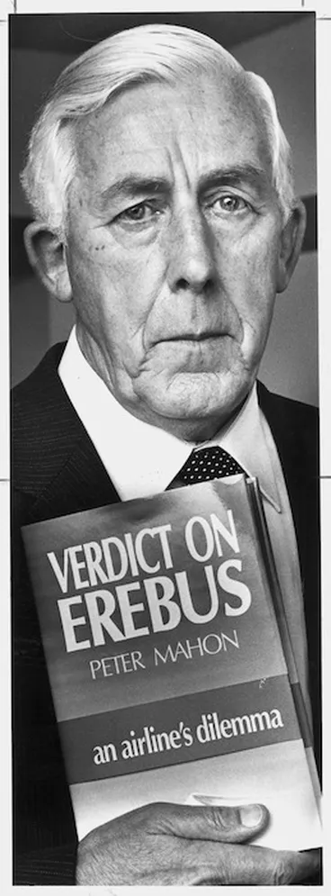 Image: Former High Court judge, and Head of the Commission of Enquiry into the Erebus disaster, Peter Mahon, with his book Verdict on Erebus - Photograph taken by Ray Pigney