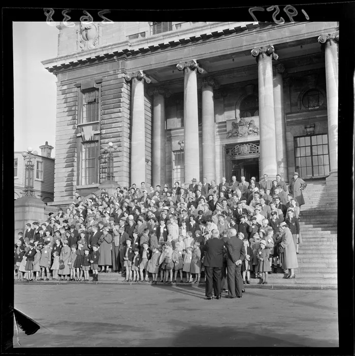 Correspondence School pupils with parents and staff on the steps of Parliament Buildings, Wellington