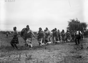 Image: Row of women with poi, at Kaiwhaiki - Photograph taken by William Henry Thomas Partington