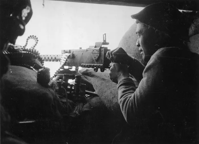 Private Nepia of the Maori Battalion firing his Browning machine gun 300 yards from the Senio River - Photograph taken by J Short