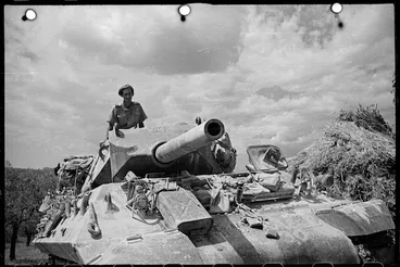Image: World War II soldier from New Zealand, 2nd Lieutenant H W Tingey, in the turret of a M10 (tank buster), in a forward area near Florence, Italy - Photograph taken by George Kaye