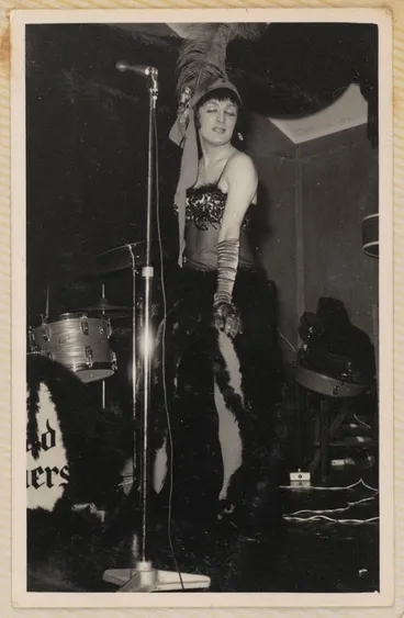 Image: Drag performer on stage. From Johnny Croskery’s photograph album 1960-1980