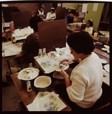 Image: Transparency - Eileen Machin applying transfers to casseroles in Sapphire